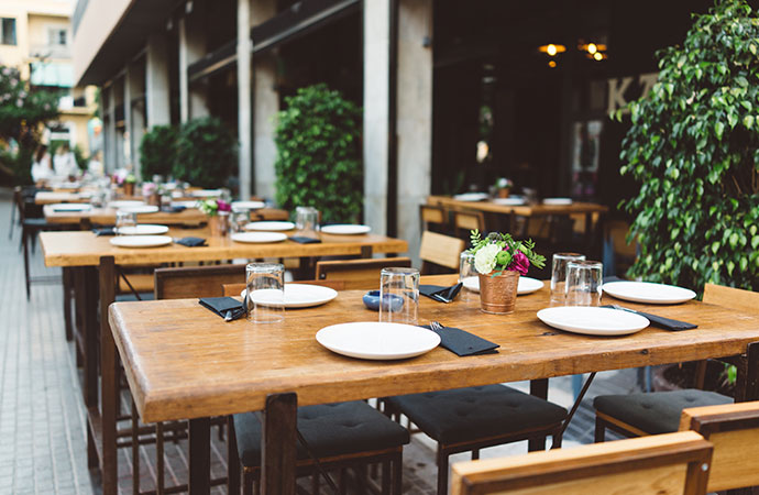 Dish on the wooden table in outdoor restaurant